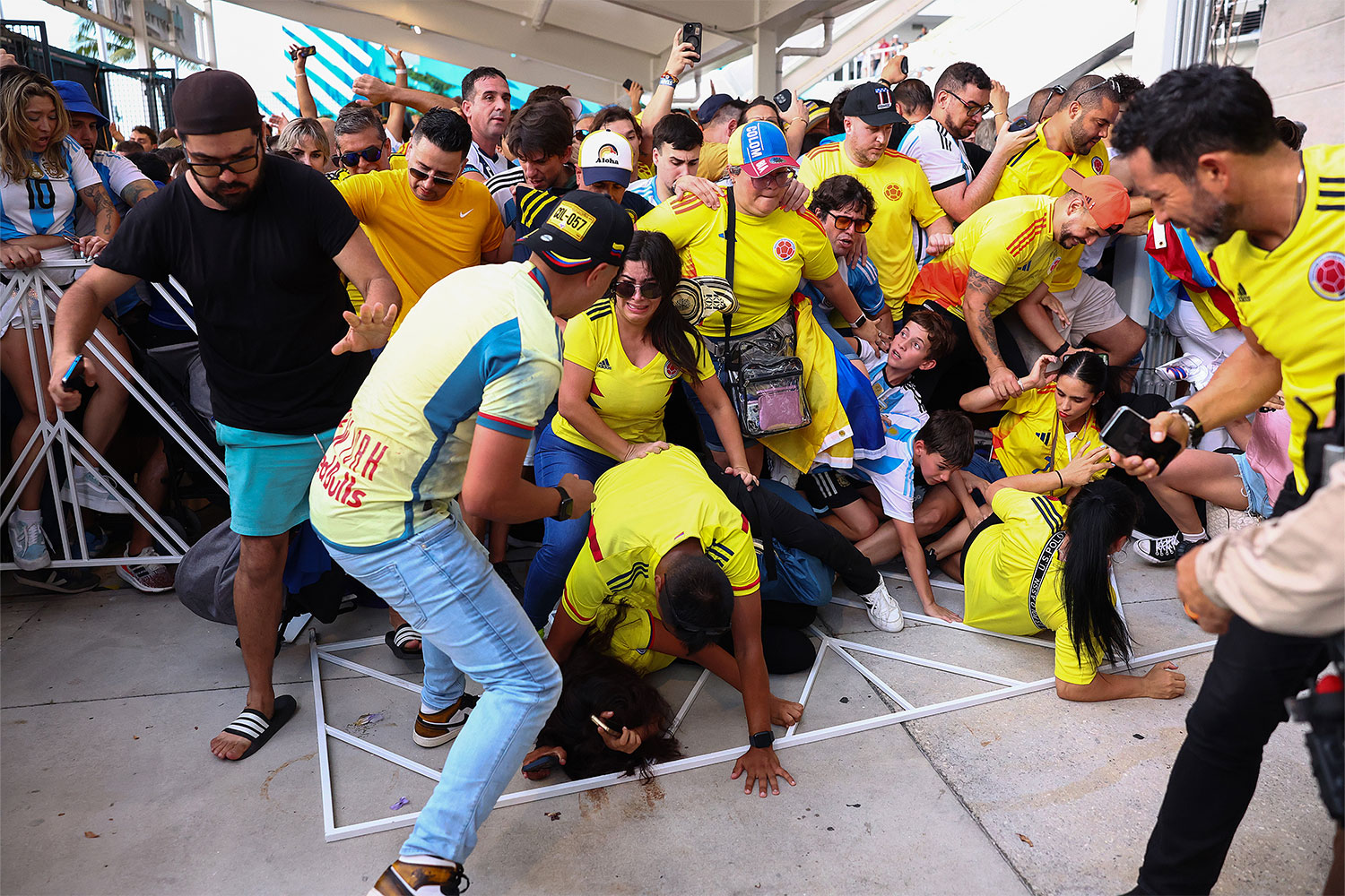 Fans of Colombia and Argentina try to pass the gate amid disturbances the CONMEBOL Copa America 2024 Final match between Argentina and Colombia at Hard Rock Stadium on July 14, 2024 in Miami Gardens, Florida