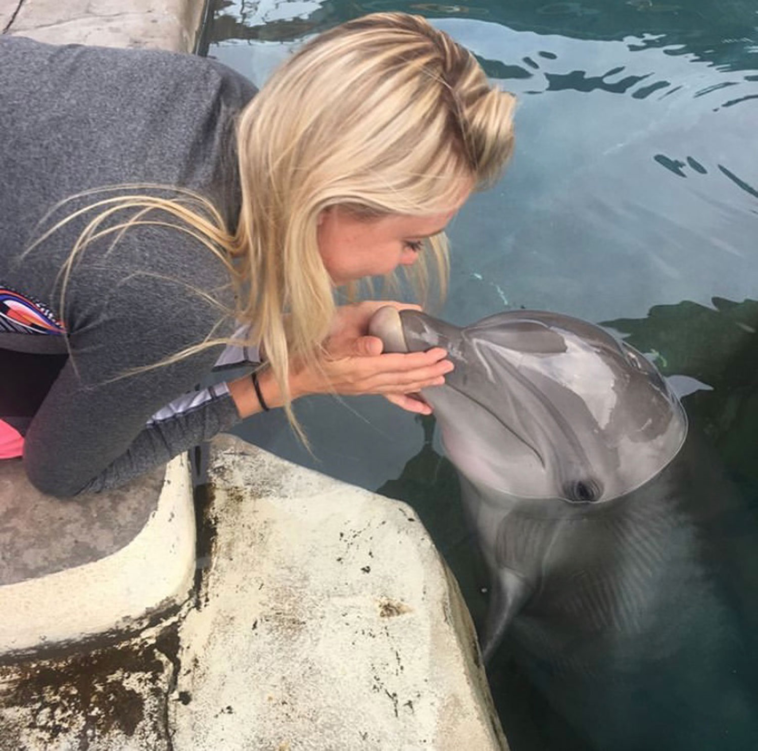 Dr. Jenna Wallace on her last day at Dolphinaris Arizona with Alia. The dolphin died not long after.