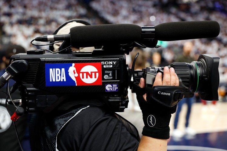 "NBA on TNT" logo on a camera. Warner Bros. Discovery is currently in a battle with Amazon over NBA broadcast rights.