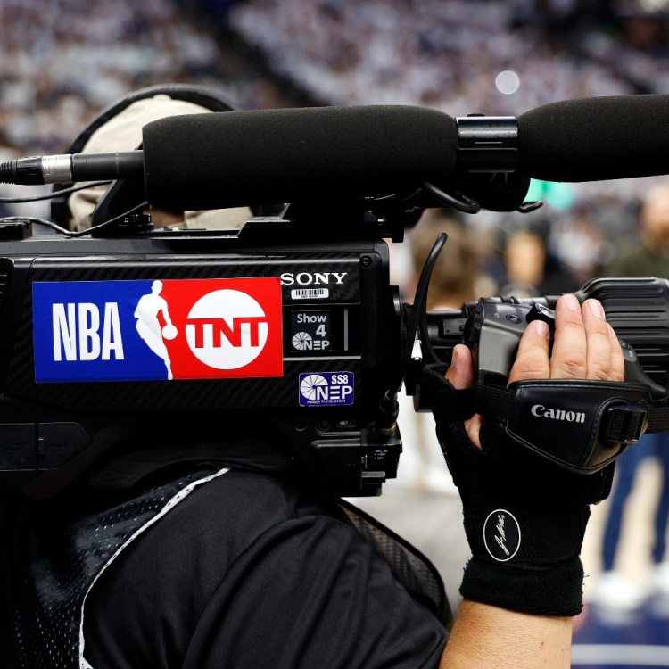 "NBA on TNT" logo on a camera. Warner Bros. Discovery is currently in a battle with Amazon over NBA broadcast rights.