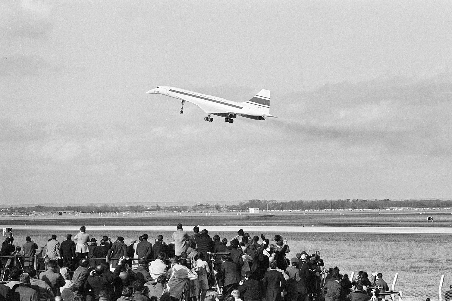 Onlookers at Toulouse Airport in France watch the first flight of the Concorde on March 2, 1969.