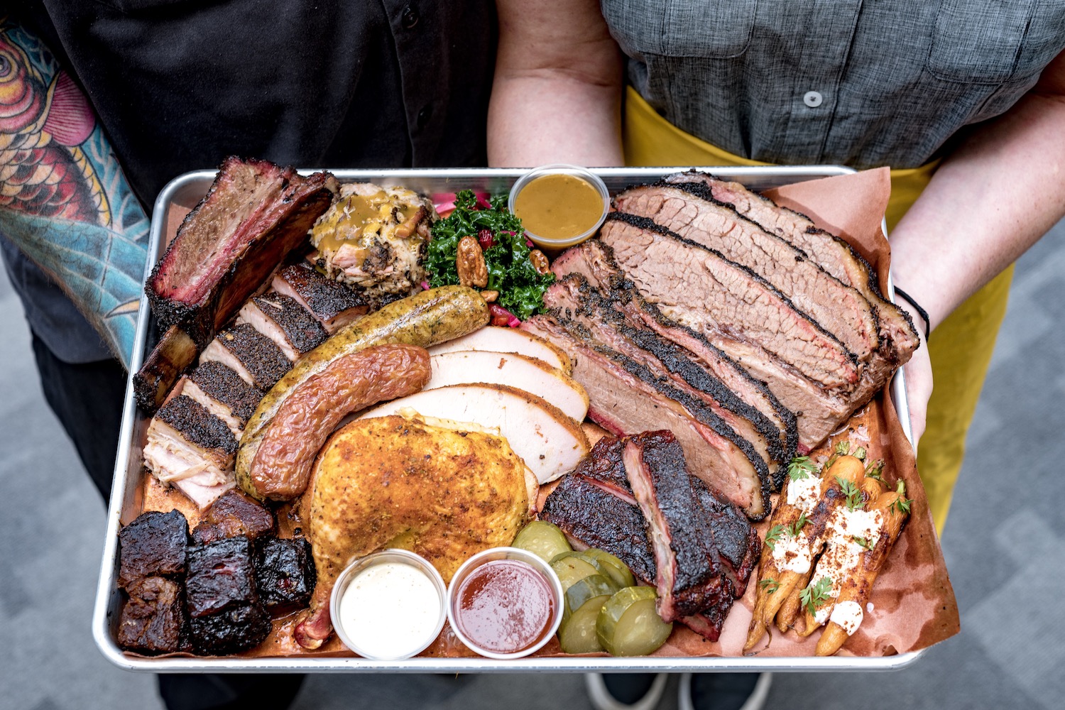 Feges's favorites include the charred Caesar, the chopped brisket sandwich, and the whole hog platter