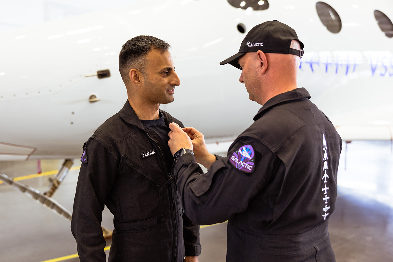 A photo of Janjua receiving an official pin for his pilot uniform.