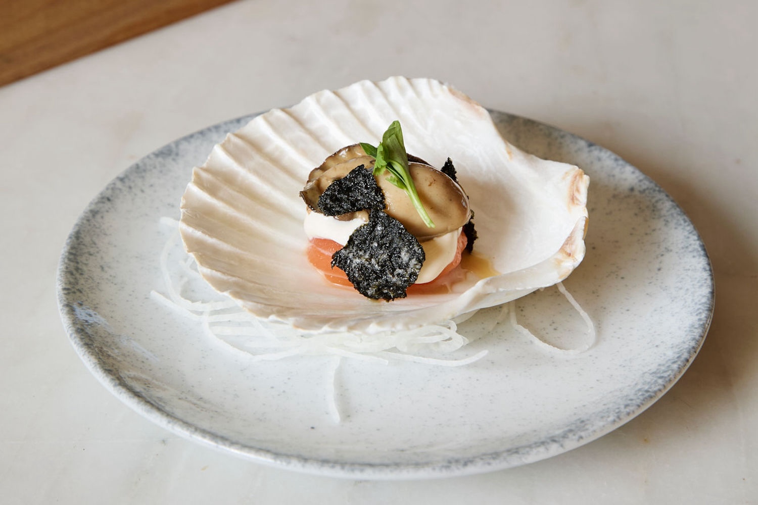 Bungalow Kitchen's zensai — monkfish liver with ponzu sauce jelly, boiled oyster and salmon with truffle cream sauce and fried seaweed