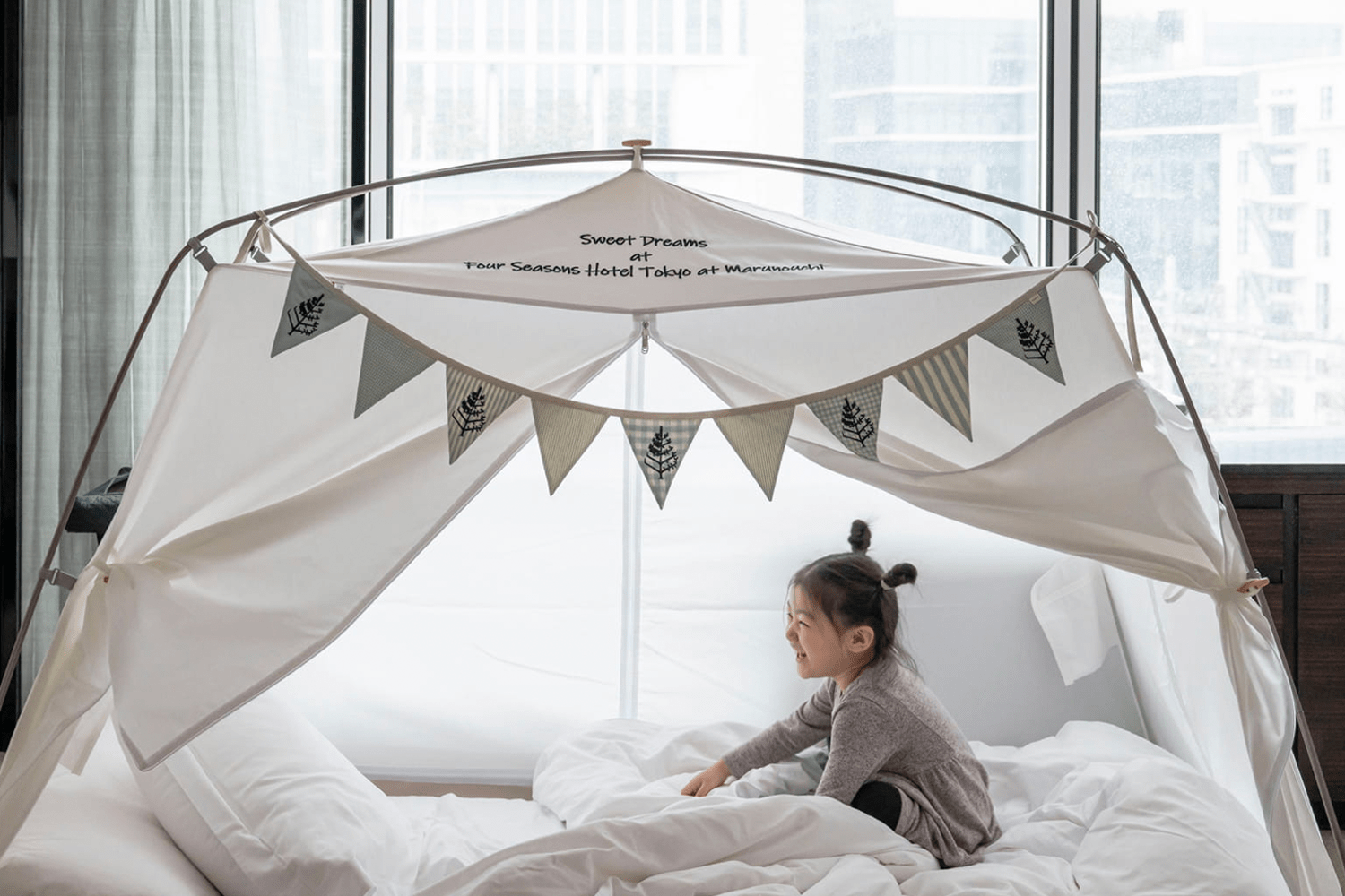 little girl in a glamping tent