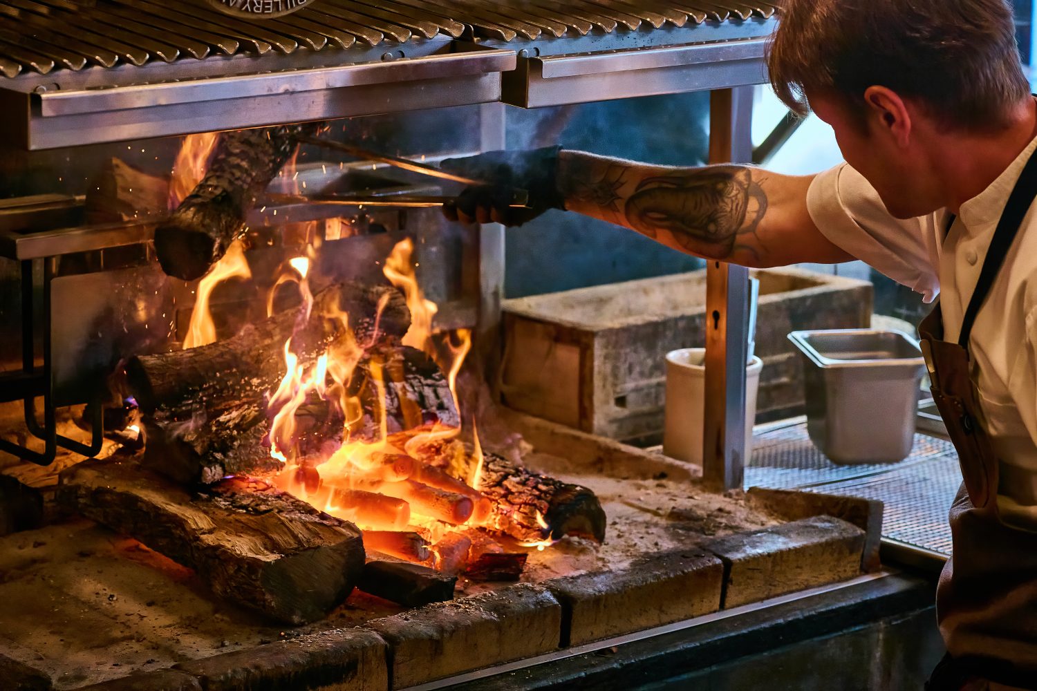 Chef grilling steak at Niku Steakhouse in San Francisco