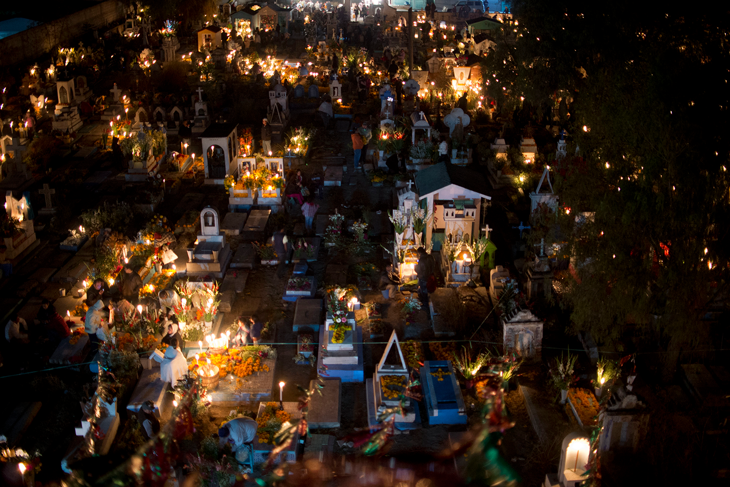 People visit a cemetery in Puebla