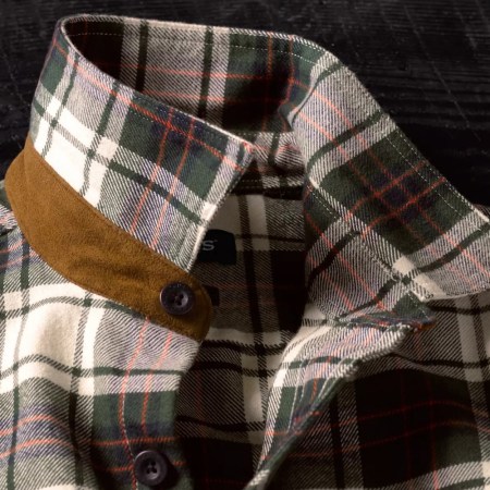 The faux suede collar and large buttons on a men's flannel shirt from Orvis