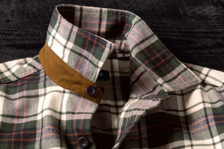 The faux suede collar and large buttons on a men's flannel shirt from Orvis