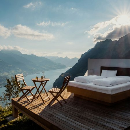 A hotel bed out in the open in Switzerland. A new Hilton report on travel trends forecasts growth in "sleep tourism."