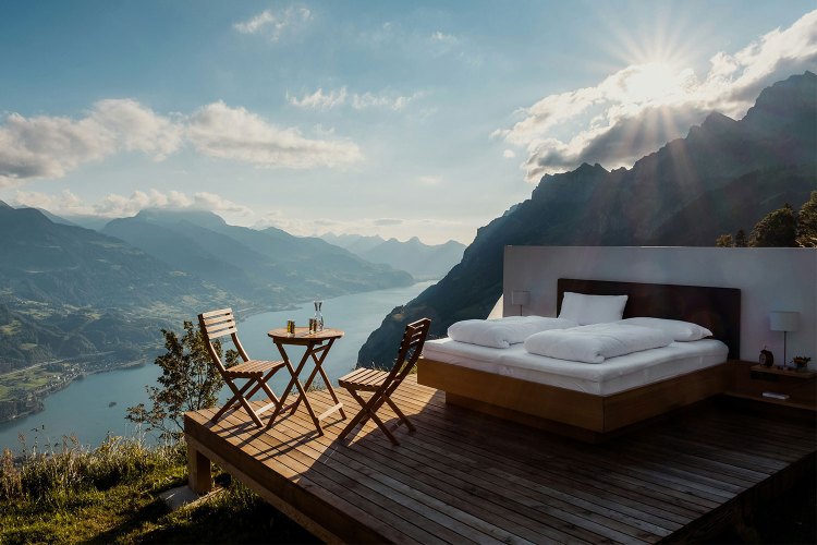 A hotel bed out in the open in Switzerland. A new Hilton report on travel trends forecasts growth in "sleep tourism."