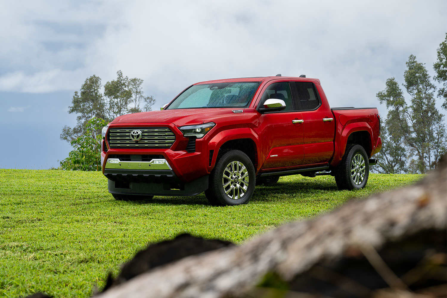 A four-door 2024 Tacoma truck in red