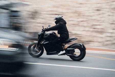 A biker riding an electric motorcycle from Verge