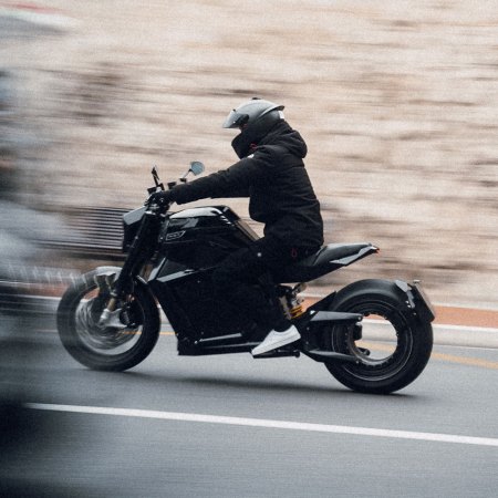 A biker riding an electric motorcycle from Verge