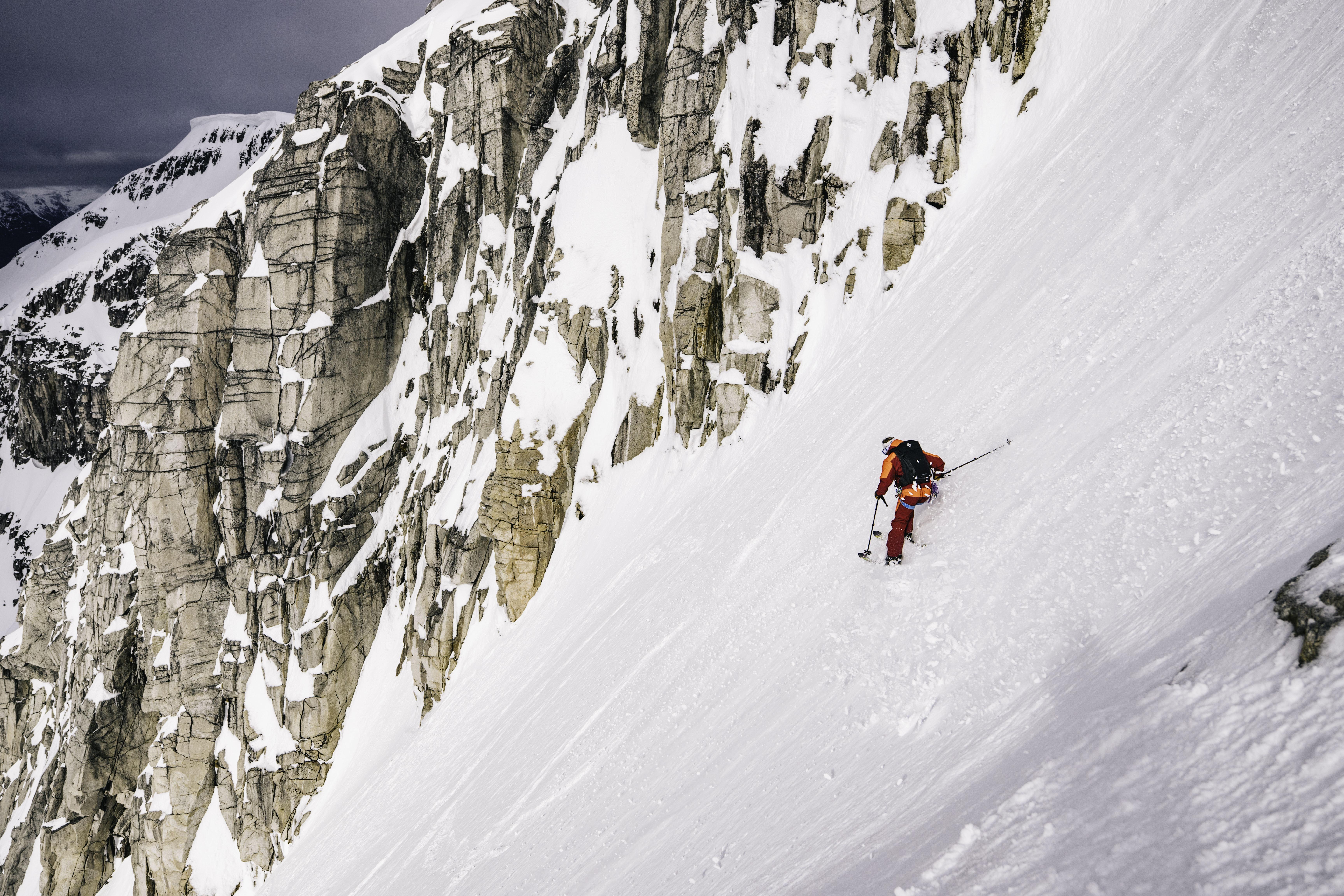 A man skis down an untouched mountain in the Andes.