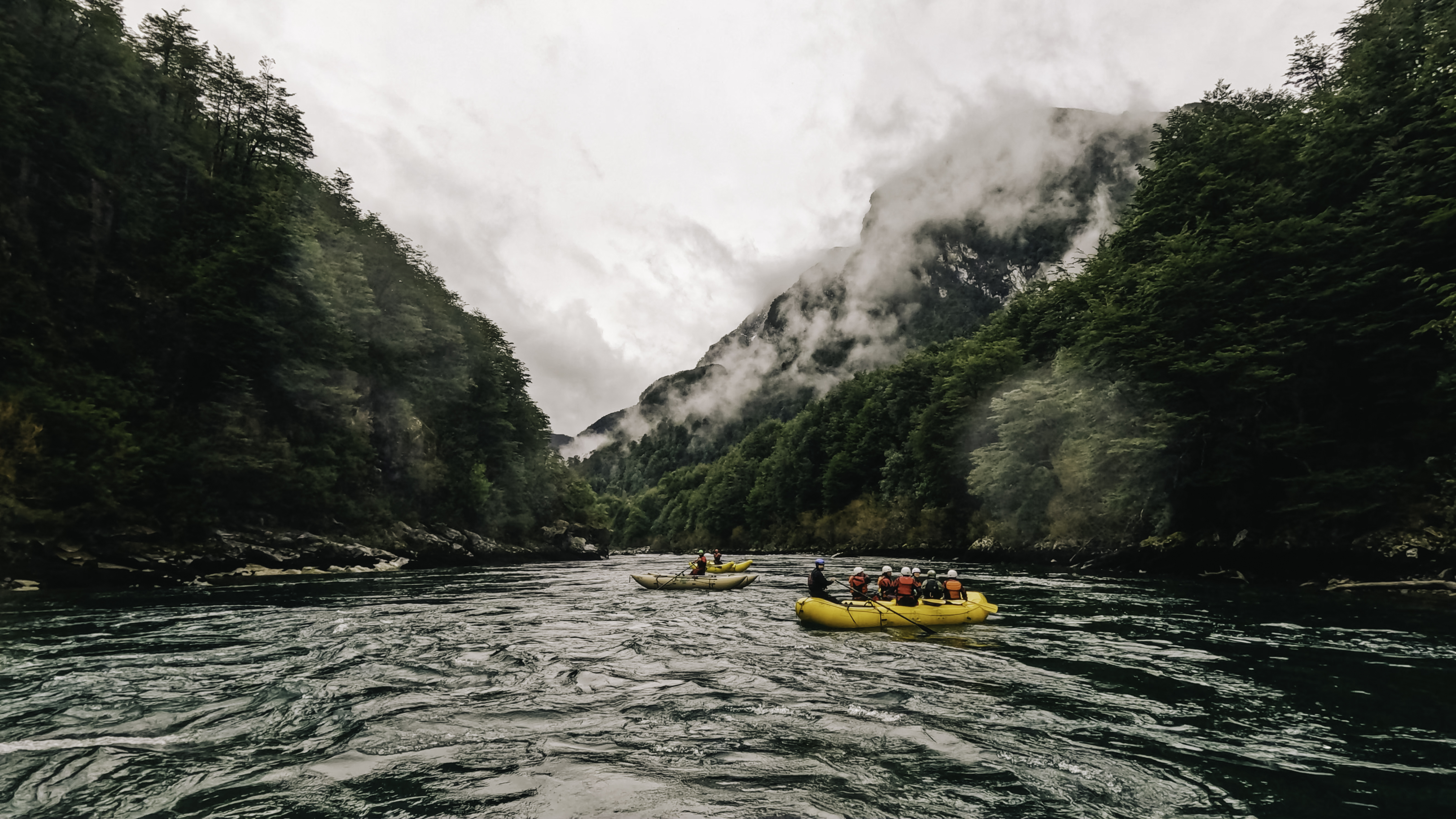 Another view of rafts making their way down the river.