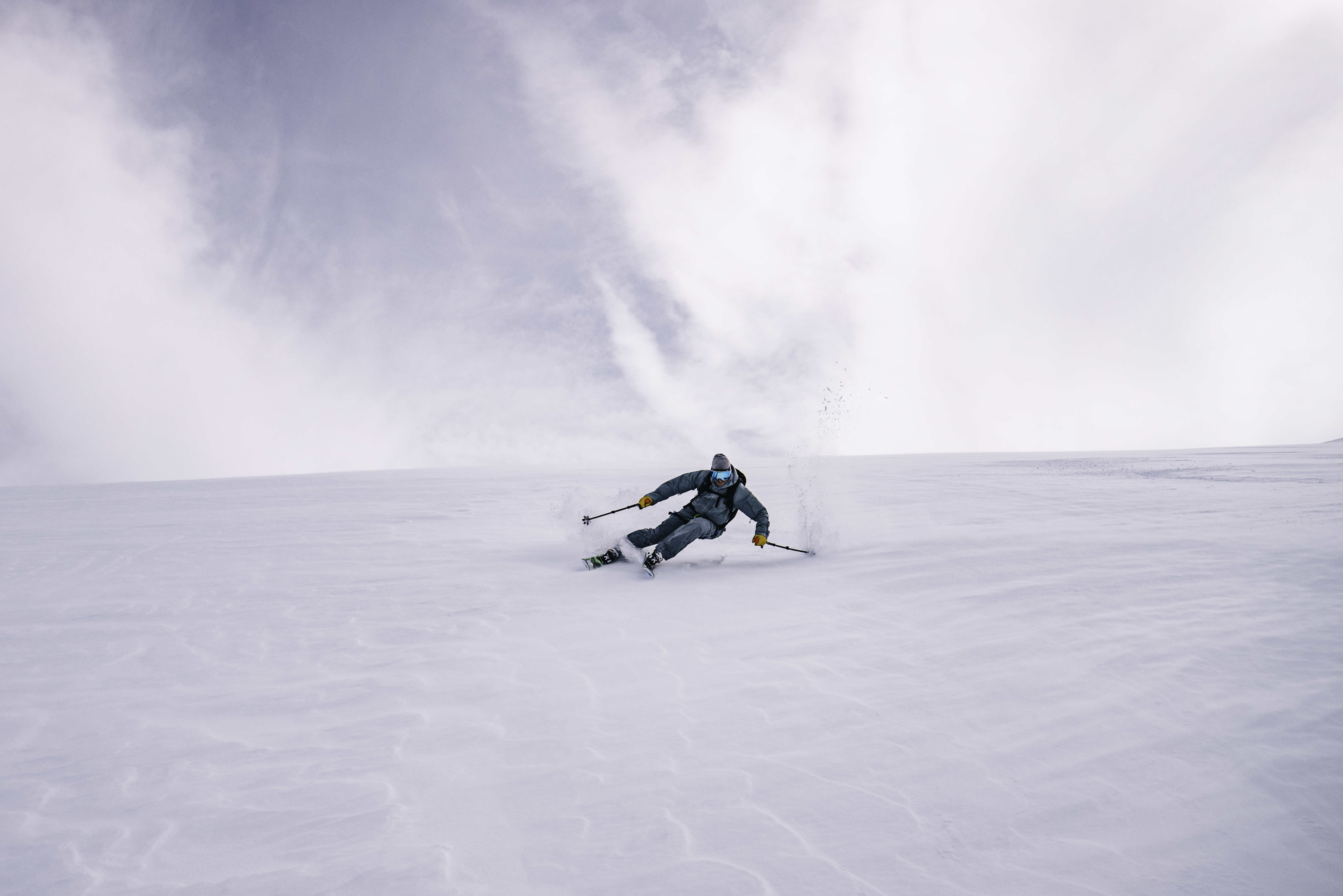 Another skier carves down a pristine mountain in the Andes.