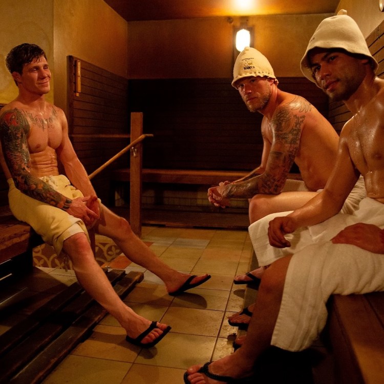 Three men sitting in Banya Russian Sauna