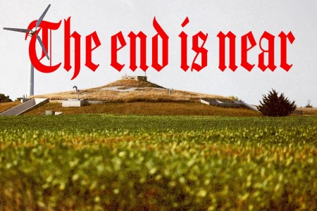 A view of a bunker on the horizon, with the words "The end is near" written in gothic red across the sky.