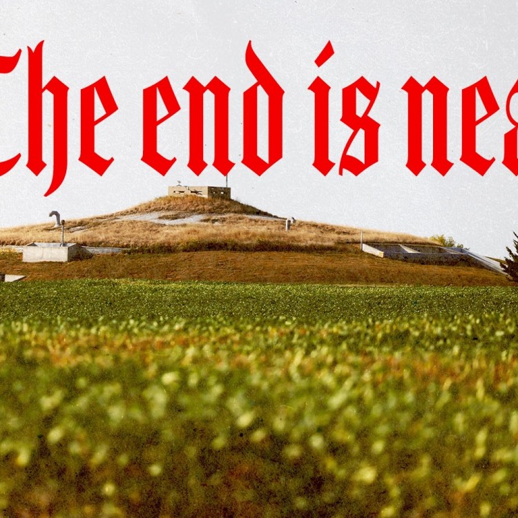 A view of a bunker on the horizon, with the words "The end is near" written in gothic red across the sky.