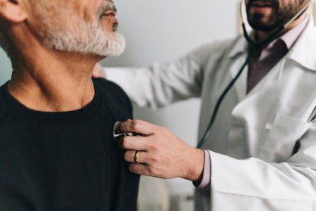 Doctor listening to a patient's heart