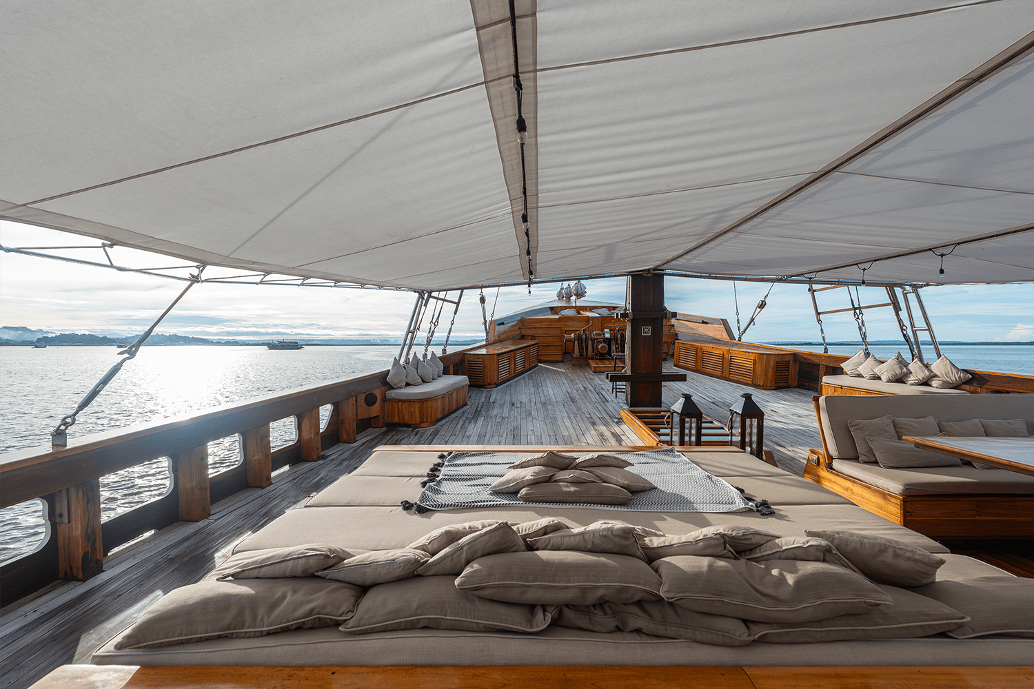 Oversized day beds on the yacht’s beamy bow