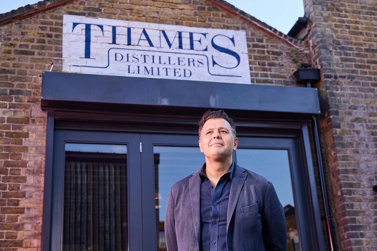 Simon Ford of Fords Gin in front the Thames Distillery