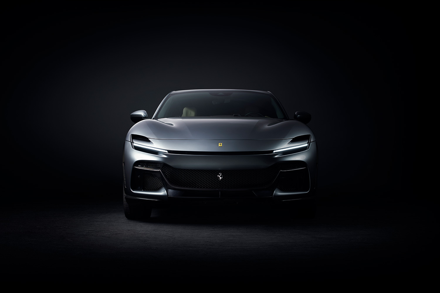 Ferrari Purosangue SUV with a black background