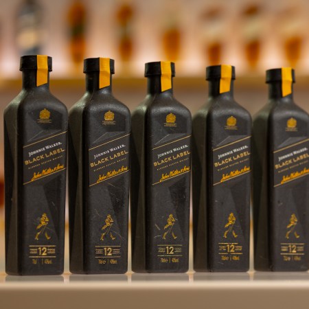 5 bottles of Johnnie Walker black label in paper bottles