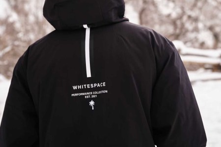 A man wearing a Whitespace ski jacket.