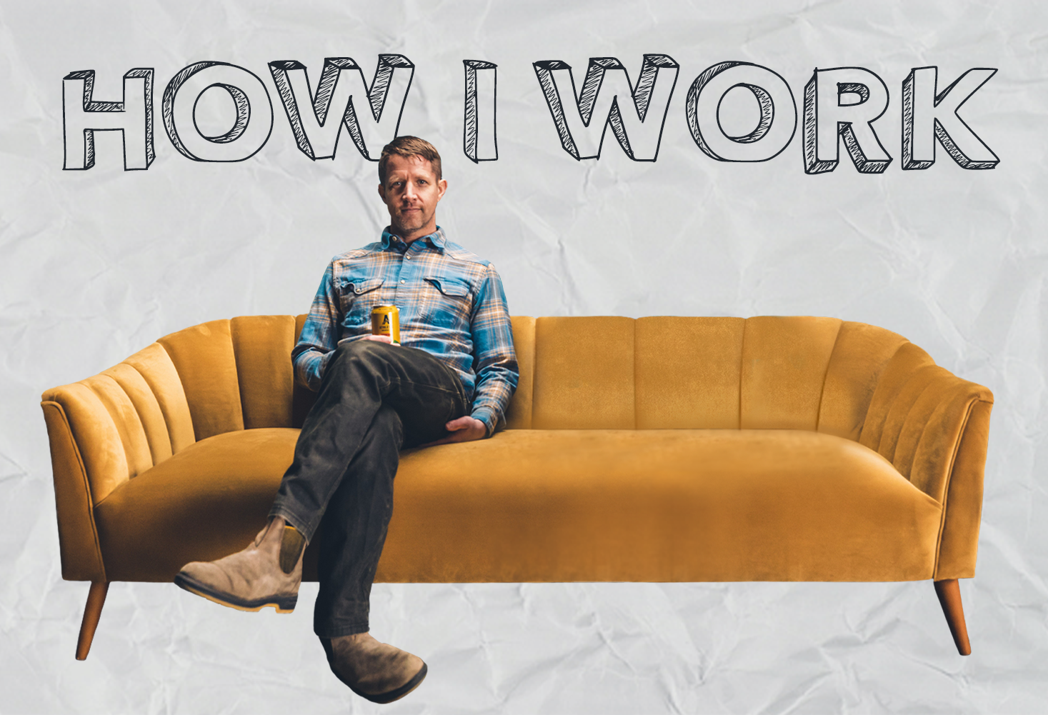 John Walker, the co-founder and COO of non-alcoholic brewery Athletic Brewing, sitting on a couch with the words "How I Work" behind him