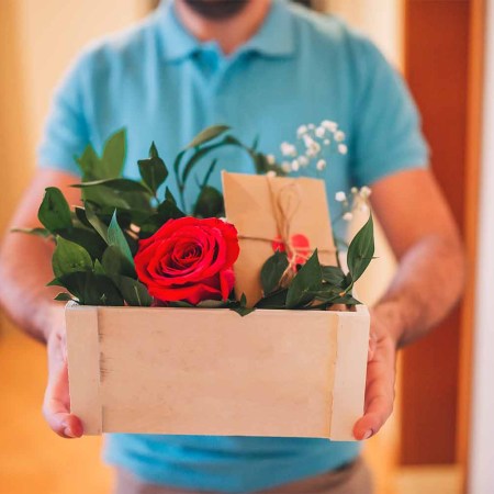 A man delivering roses