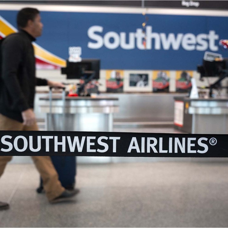 Passengers check in for Southwest Airlines flights at Chicago Midway International Airport on February 18, 2025 in Chicago, Illinois.