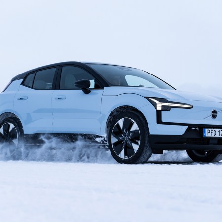 2025 Volvo EX30, a small electric SUV, driving in the snow