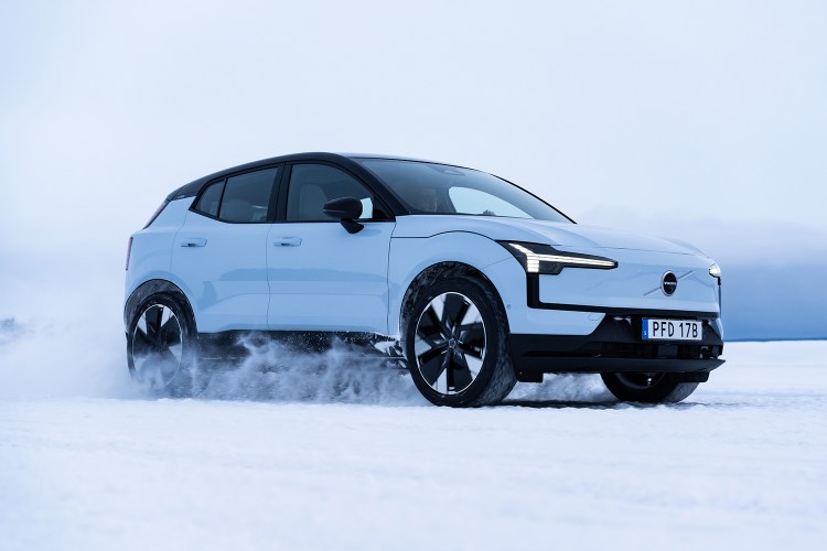 2025 Volvo EX30, a small electric SUV, driving in the snow